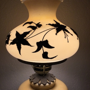 Vintage hurricane lamp with applied gold pattern