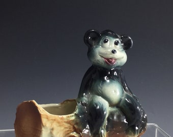 Vintage bear on log planter