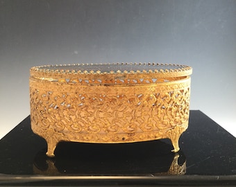 Vintage filigree jewelry box with glass lid