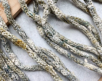 Hand spun I-cord yarn for knitting, crochet, weaving and other fiber arts.