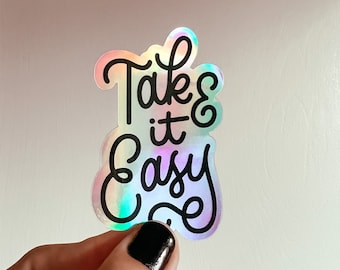 Take It Easy Sticker – holographic vinyl sticker, black line art, fun cursive lettering, waterproof, dishwasher safe, cute hand lettering