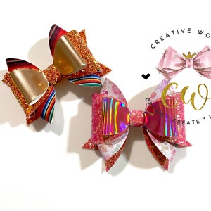 May include: Two handmade hair bows, one with a red, orange, and yellow striped pattern and gold glitter, and the other with a pink and white floral pattern and iridescent glitter.
