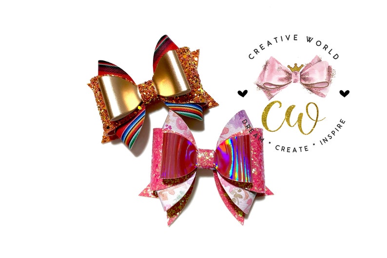 May include: Two handmade hair bows, one with a red, white, and blue striped pattern and gold glitter, and the other with a pink and iridescent glitter pattern. The bows are on a white background with a logo that says "Creative World" and "Dream, Create, Inspire".