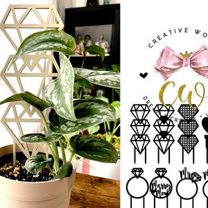 May include: A set of 10 black and white cake toppers featuring diamond rings, hearts, and the words "Marry Me" and "Mr. & Mrs.". The toppers are designed for wedding cakes and are perfect for adding a touch of elegance to your special day.