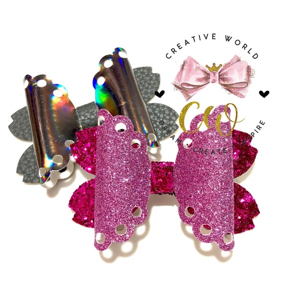 May include: Two hair bows, one with a silver iridescent finish and the other with pink glitter. Both bows have a scalloped edge and holes around the edge.