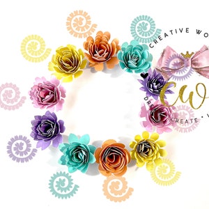 May include: A circle of colorful paper flowers in shades of pink, purple, yellow, orange, and blue. The flowers are arranged around a logo that says "Creative World" with the initials "CW" in gold lettering. The logo also includes a pink bow with a gold crown.