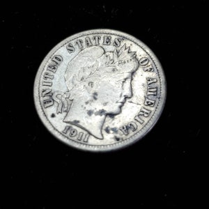 Peut inclure: Une pi&egrave;ce de monnaie am&eacute;ricaine en nickel de 1911 avec la t&ecirc;te de la Libert&eacute;.