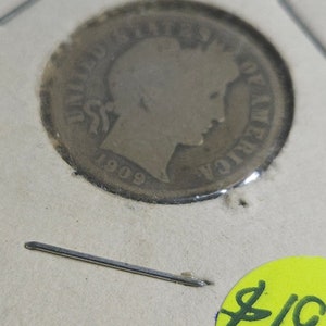 May include: A silver 1909 Liberty Head nickel coin with a price tag of $19.