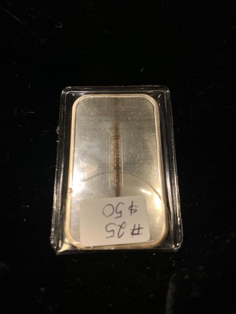 Christmas 1976-1 ounce 999 silver bar lot #25