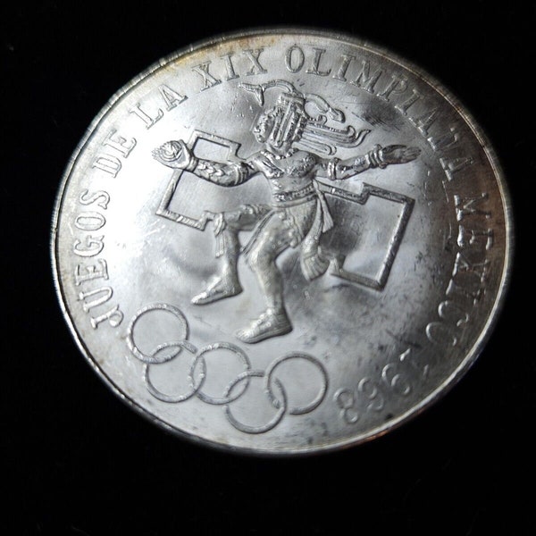 1968 Mexico  - 25 Pesos  OLYMPICS - Center  Rng  Low / Snake Tongue  CURVED Type 3 Regular 99