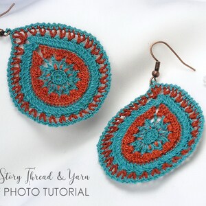 May include: A pair of teal and rust-orange crochet teardrop earrings. The earrings have a detailed, openwork pattern and copper-coloured ear wires. The image includes the text "Re-Story Thread & Yarn PDF PHOTO TUTORIAL".