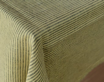 May include: A yellow and black striped linen tablecloth. The tablecloth is folded in half and the stripes are running diagonally.
