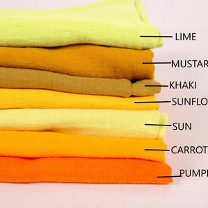 May include: A stack of eight fabric swatches in shades of yellow and orange. The swatches are labelled from top to bottom: Lime, Mustard, Khaki, Sunflower, Sun, Carrot, Pumpkin.