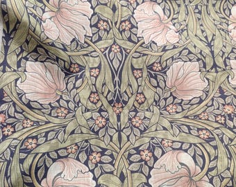 May include: A repeating pattern of pink flowers and green leaves on a dark blue background. The design is reminiscent of Art Nouveau style.