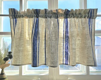May include: A pair of cream-colored linen curtains with blue stripes. The curtains are hung on a window with white trim.