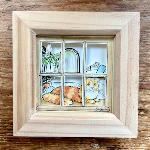 Ginger cat in a window painting papercut