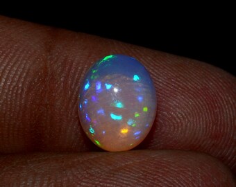 50/% discount on 0.60 ct Ethiopian welo opal.. Fire opal CABOCHON... 8x6 mm