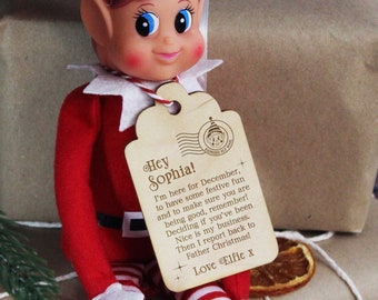 May include: A red and white striped elf doll with a wooden tag that says "Hey Sophia! I'm here for December, to have some festive fun and to make sure you are being good, remember! Deciding if you've been Nice is my business. Then I report back to Father Christmas! Love Elfie x"