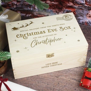 May include: A wooden Christmas Eve box with a gold inscription that reads "Special Delivery from the North Pole Christmas Eve Box for the attention of: Christopher" and "Love from Father Christmas".