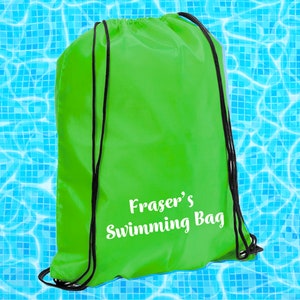 May include: A bright green drawstring bag with black drawstrings. The bag has white text that says "Fraser's Swimming Bag".