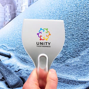 May include: A white ice scraper with a silver handle. The scraper has a colorful logo with the text "UNITY TOGETHERness".