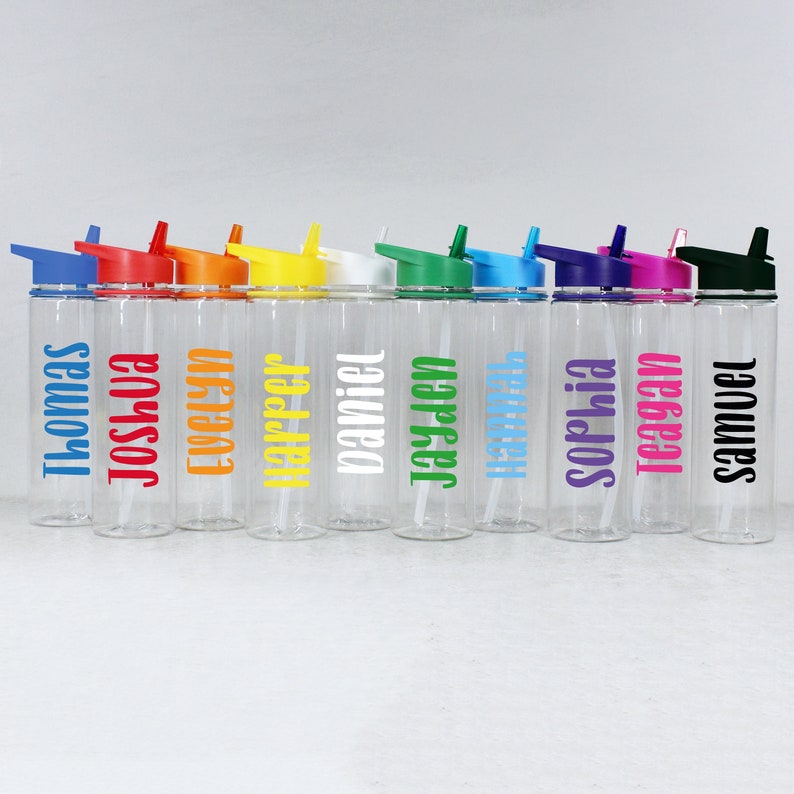 May include: Ten clear plastic water bottles with colorful lids and straws. Each bottle has a name printed on it: Thomas, Joshua, Evelyn, Harper, Daniel, Jayden, Hannah, Sophia, Teagan, Samuel.
