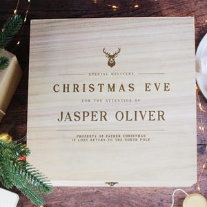 May include: A wooden box with a reindeer design and the text "SPECIAL DELIVERY CHRISTMAS EVE FOR THE ATTENTION OF JASPER OLIVER PROPERTY OF FATHER CHRISTMAS IF LOST RETURN TO THE NORTH POLE".