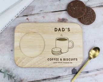 May include: A wooden serving tray with a cutout for a mug and a small plate. The tray is engraved with the text "Dad's Coffee & Biscuits Love from Freddie xx".