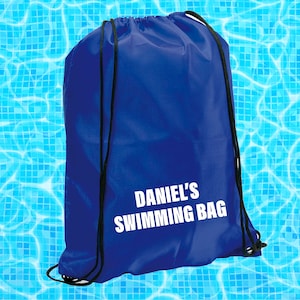 May include: A blue drawstring bag with white text that reads "Daniel's Swimming Bag".