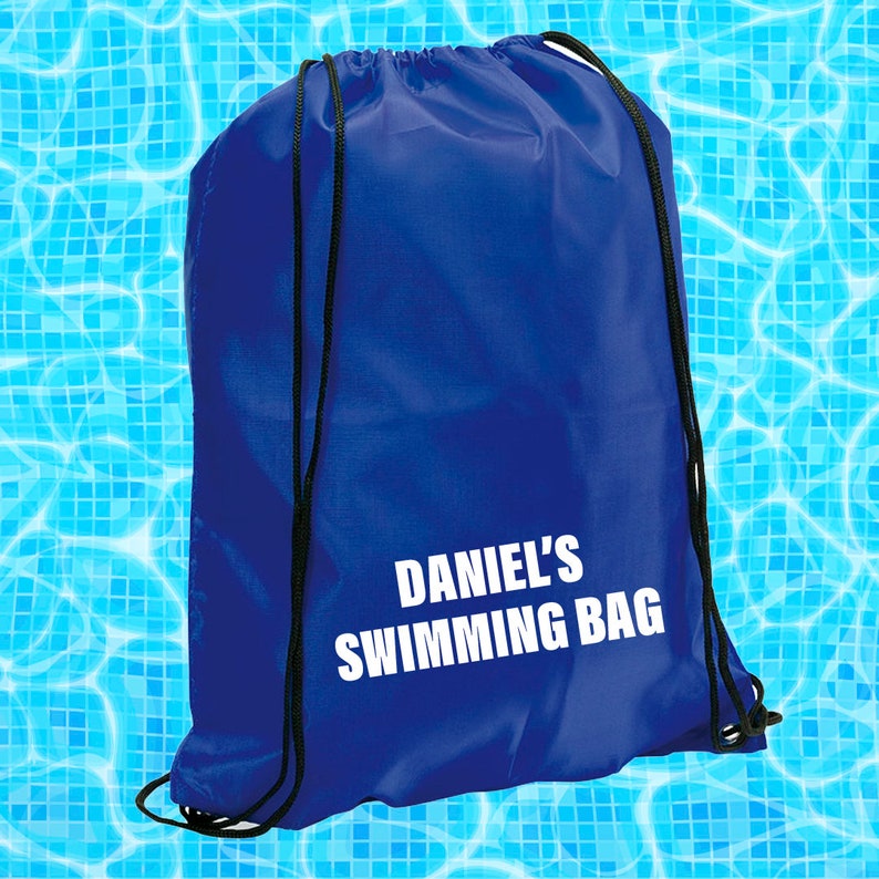May include: A blue drawstring bag with white text that reads "Daniel's Swimming Bag".