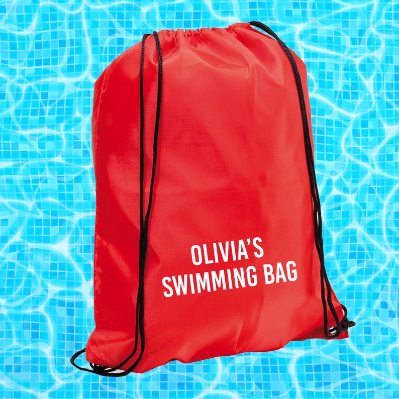 May include: Red drawstring bag with black drawstrings and the text "Olivia's Swimming Bag" in white.