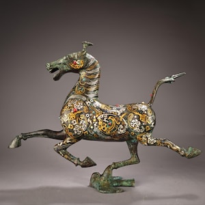 A rare and exquisite Chinese antique handcrafted bronze inlaid with gemstones and a horse stepping on a flying swallow statue