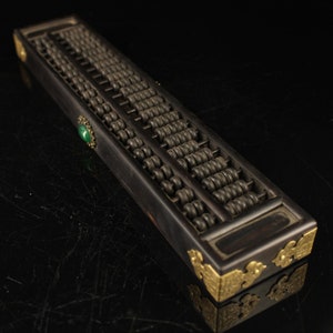Ancient Chinese black sandalwood abacus, inlaid with precious stones, has a beautiful shape