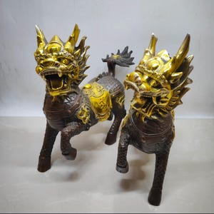 A pair of exquisite and rare pure copper gilded fortune and luck Kylin auspicious beast statues made by hand