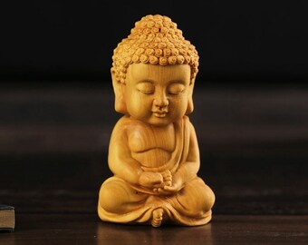 Natural boxwood carved like a Buddha statue