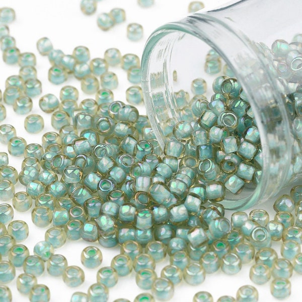 Perles de rocailles Toho 11/0  2mm AB topaz léger/ vert 10gr