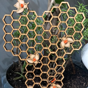 Honeycomb plant trellis with honey bees image 1