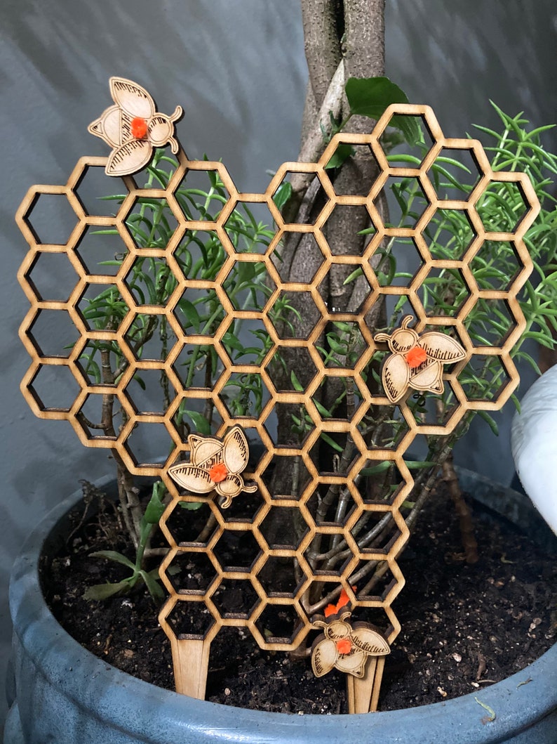 Honeycomb plant trellis with honey bees image 1