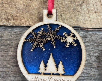 Merry Christmas night sky with snowflakes and pine trees Christmas ornament