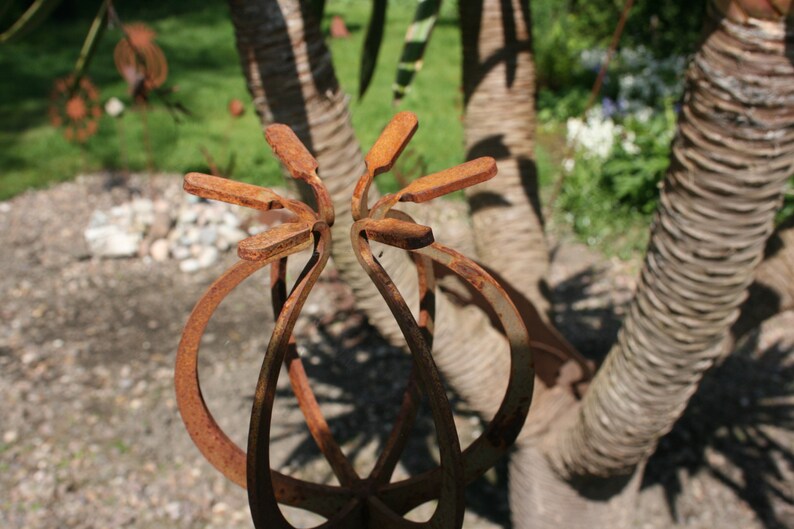 Rusted metal plant support poppy stake Rusted garden art Etsy