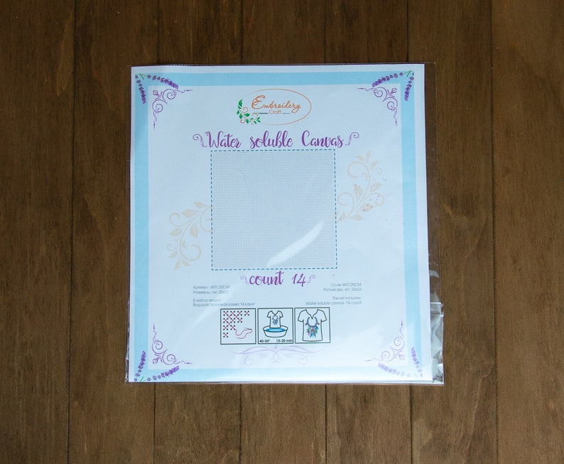 May include: A white water-soluble canvas for embroidery, packaged in a clear plastic bag. The canvas is labeled "Water soluble Canvas" and "count 14".