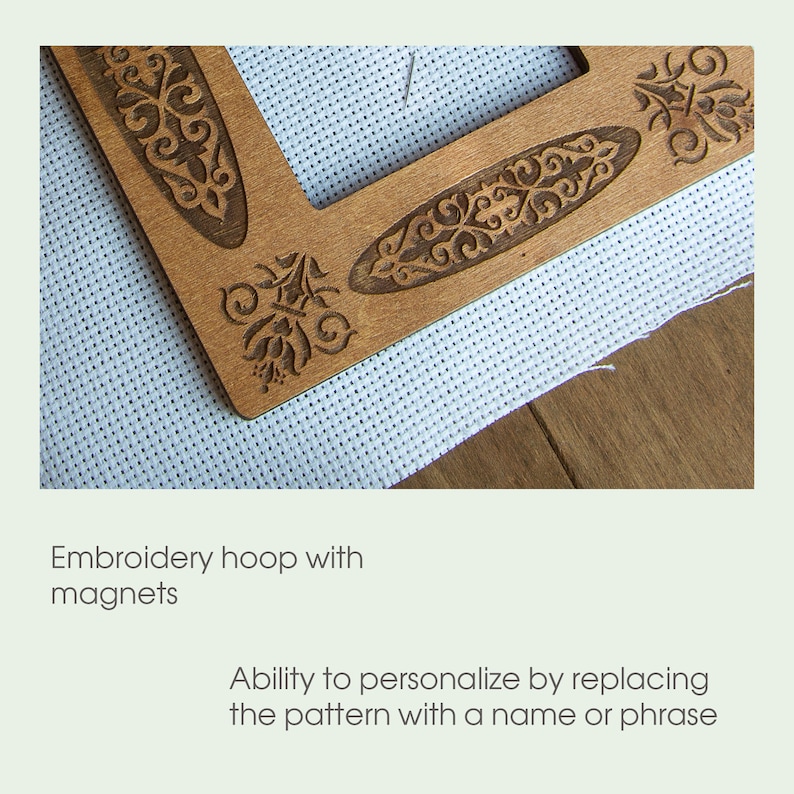 May include: A wooden embroidery hoop with a decorative pattern. The hoop has magnets to hold the fabric in place. The pattern can be personalized by replacing it with a name or phrase.