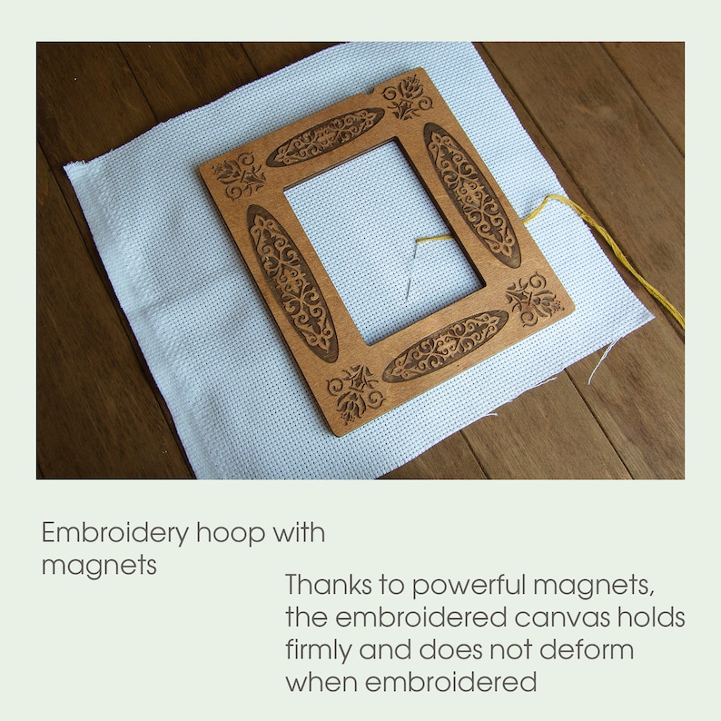 May include: A wooden embroidery hoop with a decorative design and powerful magnets to hold the canvas in place. The hoop is on a white canvas.