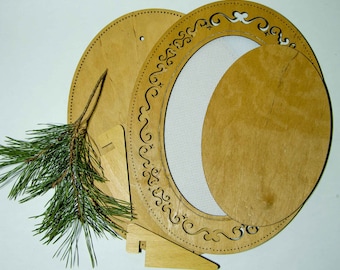 May include: A set of light brown wooden craft components including a large circular base with perforated edges, an oval frame with intricate laser-cut scrollwork surrounding a white mesh screen, a solid oval wooden insert, and two small stands.