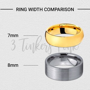 May include: Two wedding bands, one gold and one silver, side by side. The gold band is 7mm wide and the silver band is 8mm wide.  Ring Width Comparison.