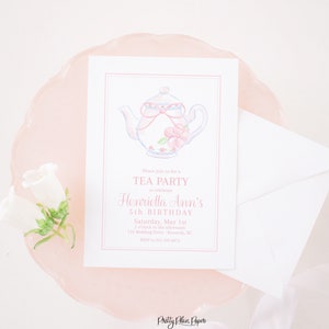 May include: A pink and blue tea party invitation with a watercolor illustration of a teapot with a pink bow. The text reads "Please join us for a Tea Party to celebrate Henrietta Ann's 5th Birthday. Saturday, May 1st, 1 o'clock in the afternoon, 131 Bedding Drive, Kently, SC. RSVP 843-212-3873. Pretty Plain Paper."