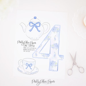 May include: Printable cake topper featuring a blue teapot, teacup, and the number four decorated with blue floral patterns. The text "Pretty Plain Paper CAKE TOPPER" and instructions for assembly are included.