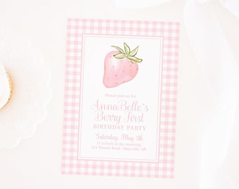 May include: Pink and white gingham patterned invitation with a watercolor illustration of a strawberry. The text reads "Please join us for Anna Belle's Berry First Birthday Party Saturday, May 5th 11 o'clock in the morning 213 Timon Road Maysville, AR Pretty Plain Paper"