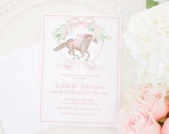 May include: A pink and white baby shower invitation with a watercolor illustration of a horse and rider. The text reads "It's a Girl!" and "Please join us for a baby shower honoring Lilibeth Johnson and her baby girl on the way. Saturday, May 2nd at two o'clock in the afternoon. 3202 Firefly Lane Henderson, KY. RSVP to Katie at (302) 402-9322. Pretty Plain Paper."