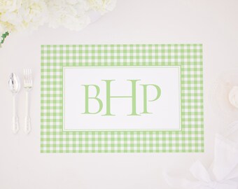 May include: Green and white gingham placemat with a white border and a monogram in the center that reads "BHP".